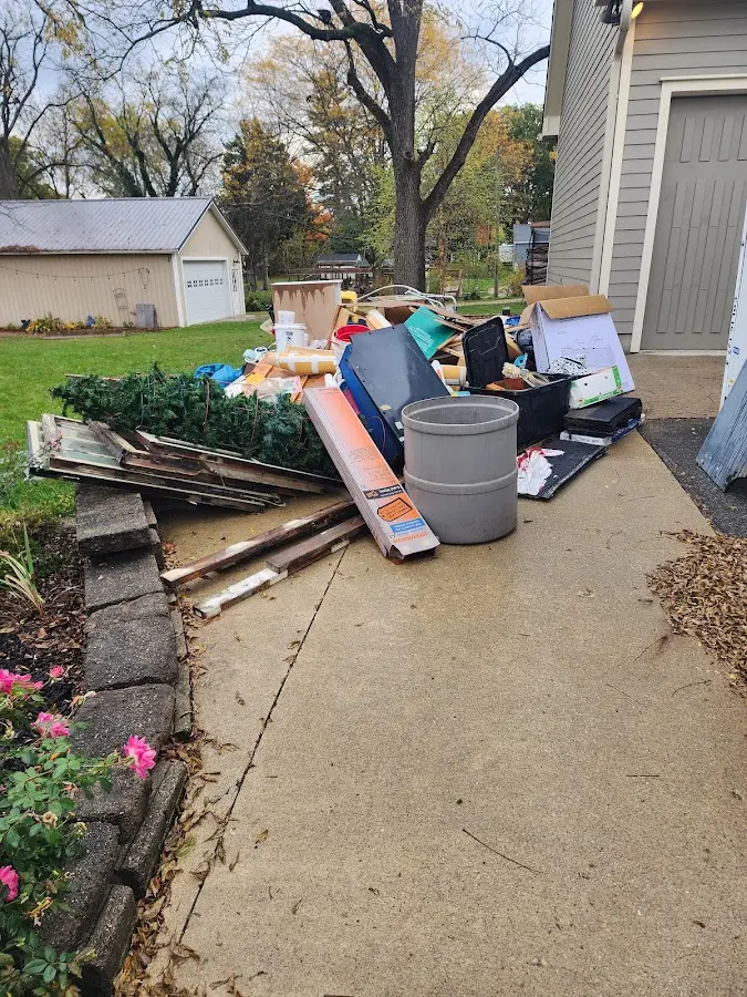 Dumpster being loaded with debris for 30 Yard Dumpster Rental in Beach Park